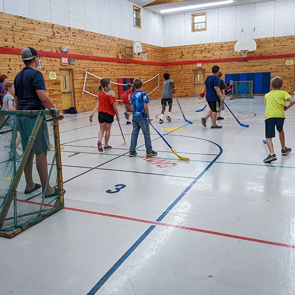 Floor hockey in the gym